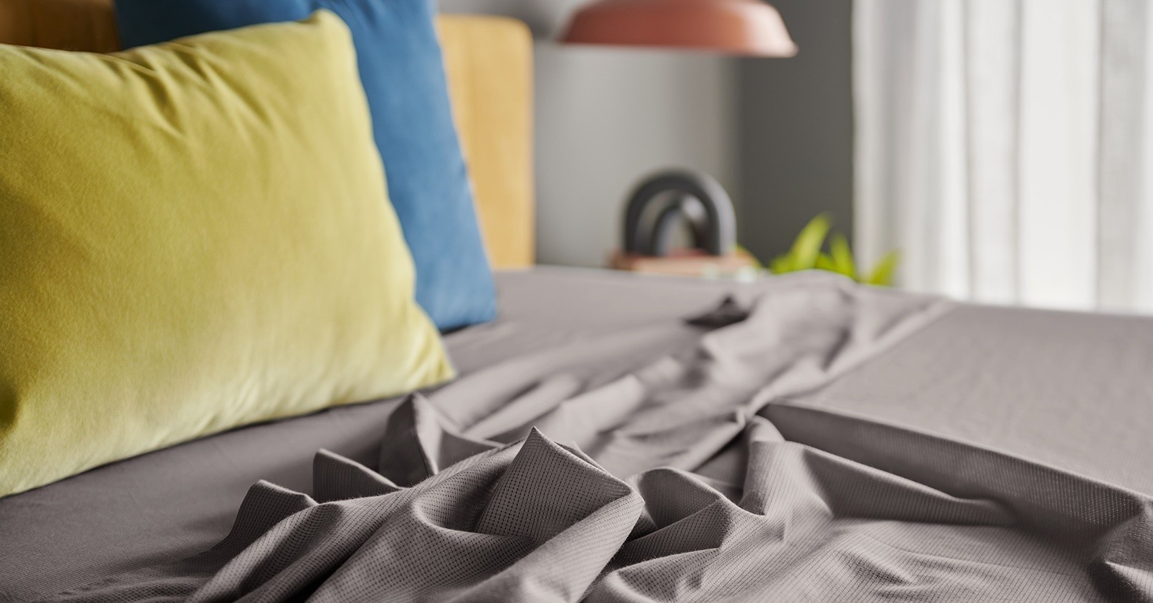 Cool Gray ProAir Sheets on styled bed