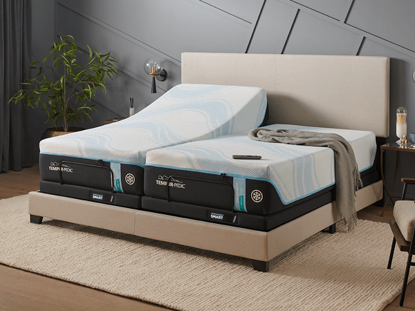 An articulated TEMPUR-LuxeBreeze Split King Mattress on a TEMPUR-Ergo Smart Base in a Styled Room