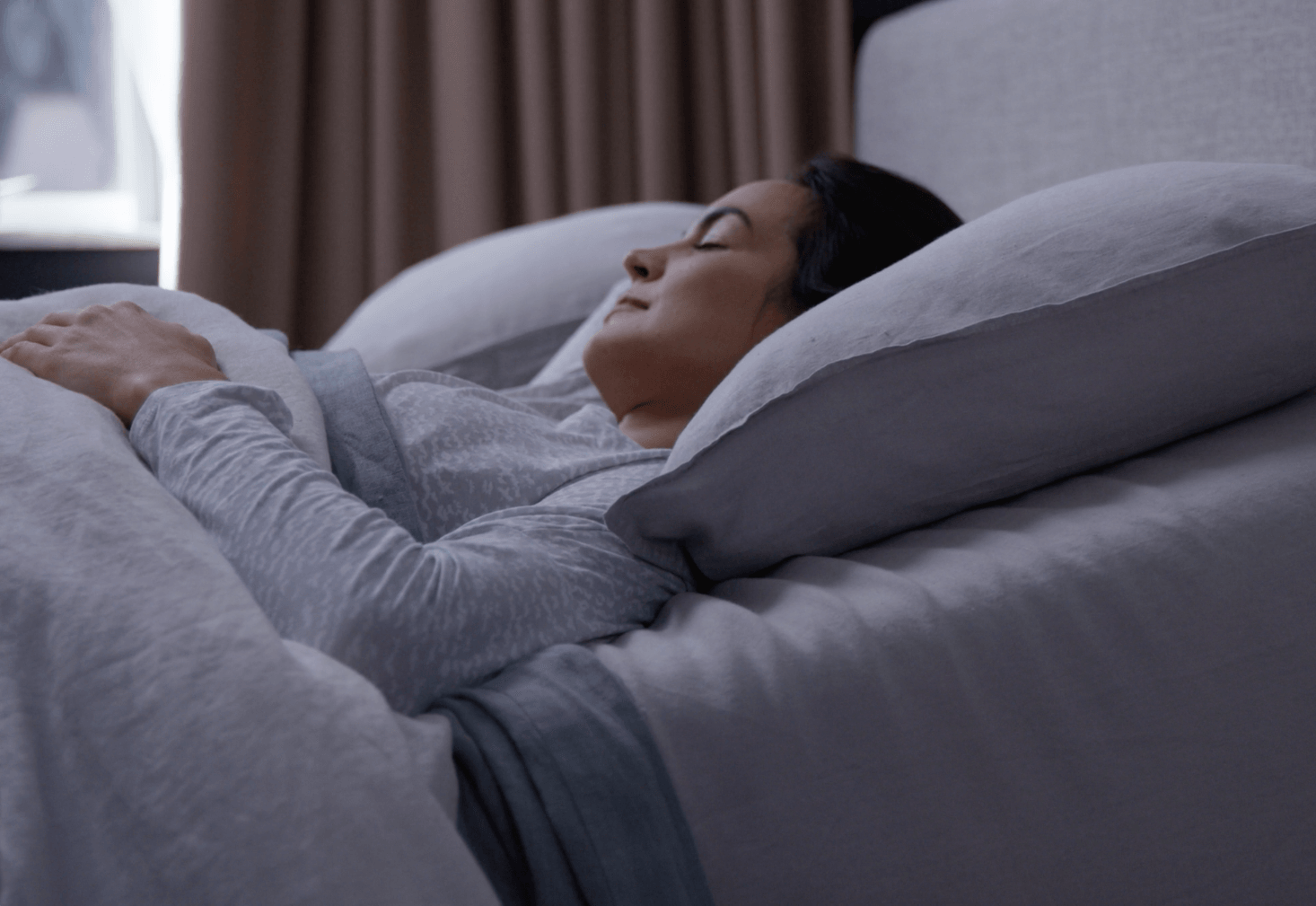 Woman sleeping soundly all night long on a Breeze mattress