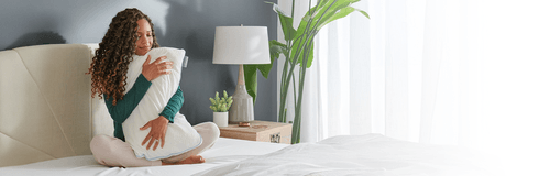 Woman hugging tempurpedic pillow