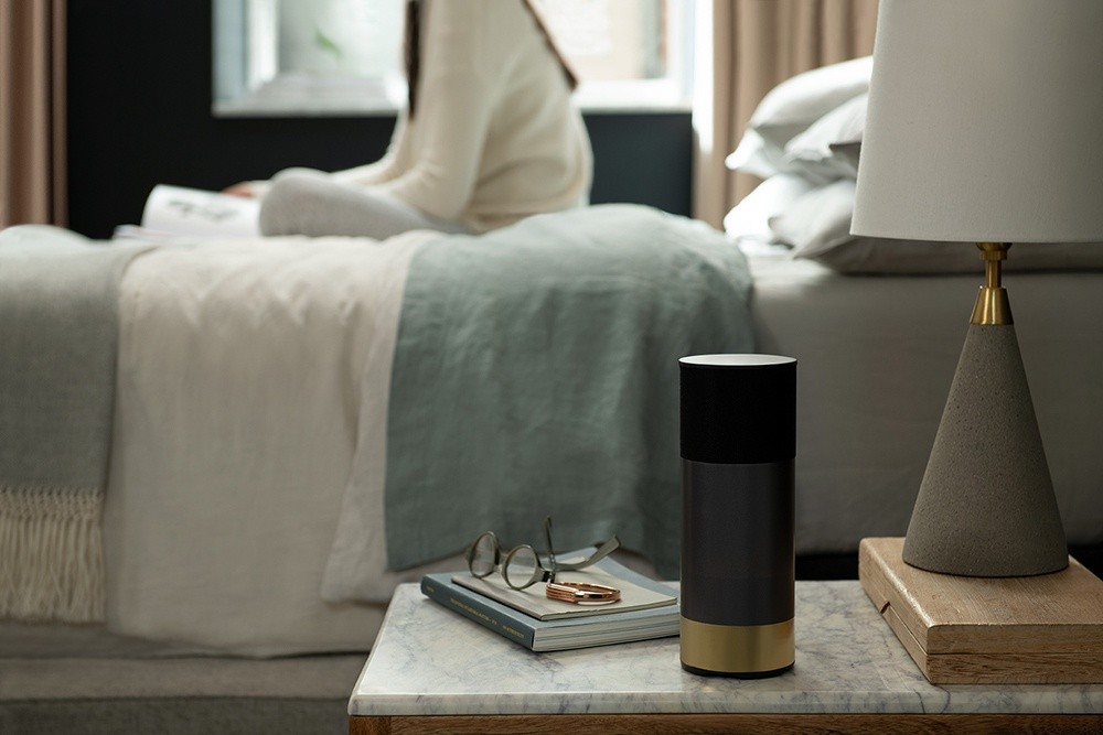 An Amazon Alexa sitting on a nightstand