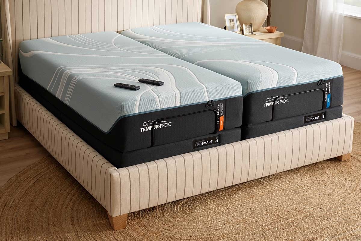 A TEMPUR-LuxeAdapt split king mattress on a TEMPUR-ProSmart adjustable base in a styled room