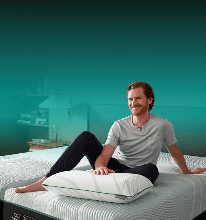 Man on undressed bed with pillow bf mobile